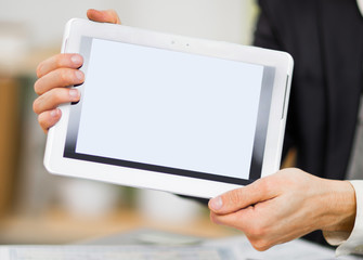 Businessman hands are holding the touch screen device.