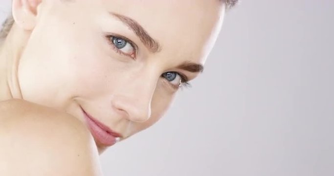 Closeup Beauty portrait of woman face with bright blue eyes skincare concept - Red Epic Dragon
