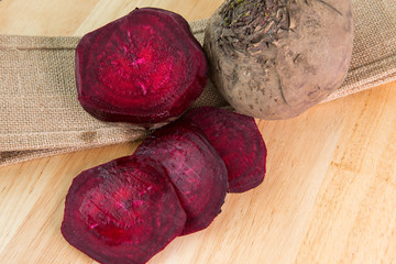 Beetroot on burlap and wooden desk
