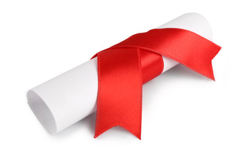 Rolled paper with red ribbon isolated on white