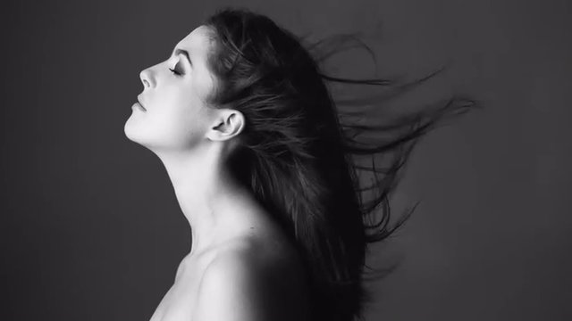 Beautiful woman with blowing hair cinemagraph