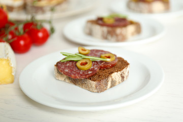 Tasty sandwiches on plates, close up