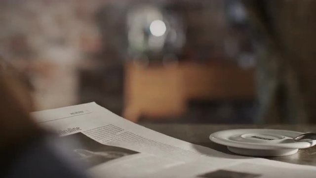 Man Reading Newspaper and Drink Coffee at Home.