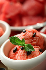 Watermelon ice cream in bowl, close-up