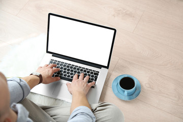 Man working with laptop at home