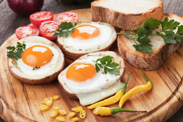 Fried eggs in potato shells
