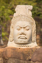 Statue of ancient khmer warrior head at Angkor Wat