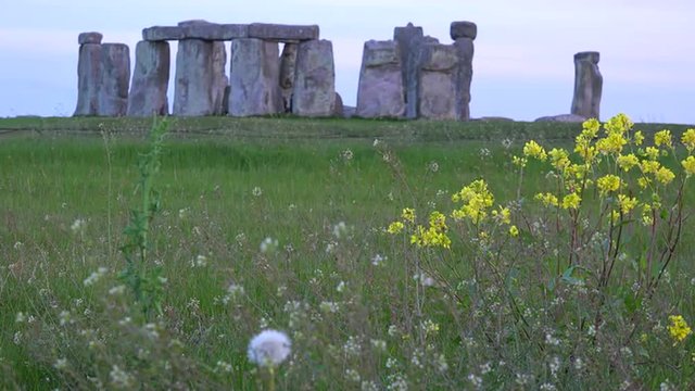 Stonehenge in the distance on the plains of England.