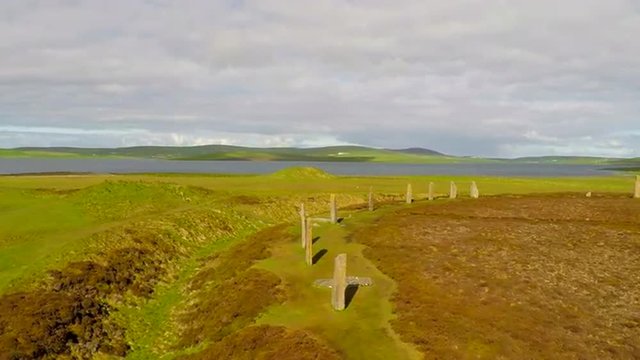 An aerial shot over sacred Celtic stones on the Islands of Orkney in Northern Scotland.