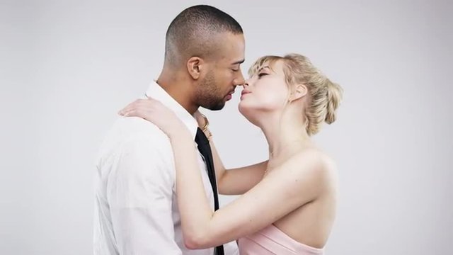 Mixed race couple kissing slow motion wedding photo booth series