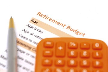 Obraz premium retirement plan document with pen and calculator