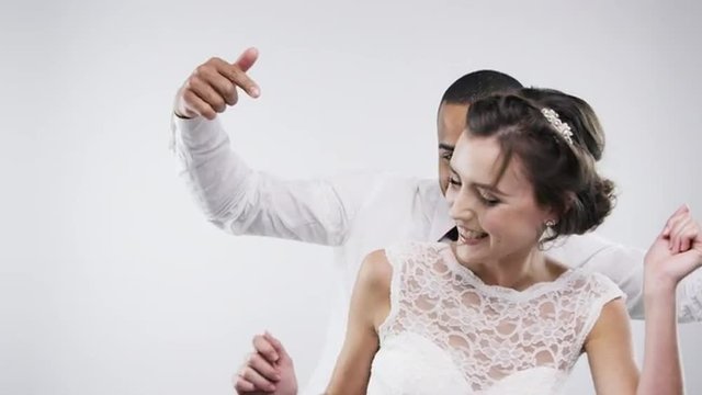 Married couple dancing slow motion wedding photo booth series