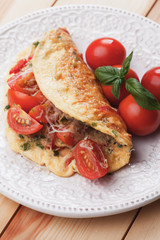 Omelet with cheese and cherry tomato