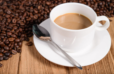 cup of coffee on wood background