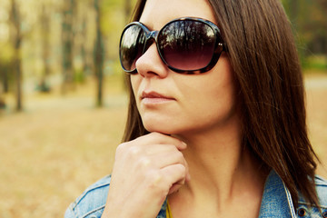 Hipster beautiful girl in jeans jacket