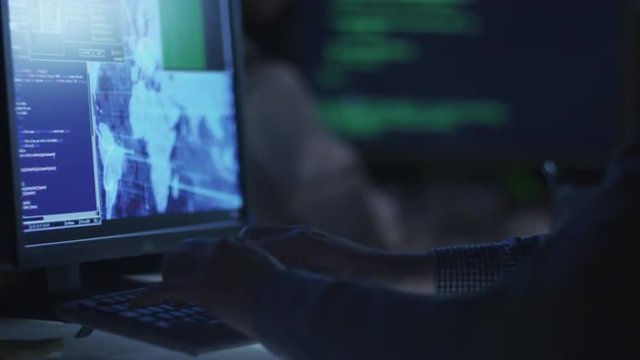 Team of IT Professionals are Working at Night
