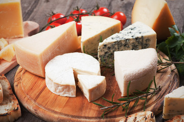 Assorted cheese on wooden platter