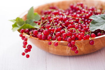 Healthy red currants in a bowl with extras