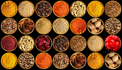 Different spices on black background