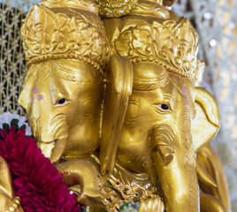 Golden Ganesh  Elephant god statue in hinduism mythology  closeu
