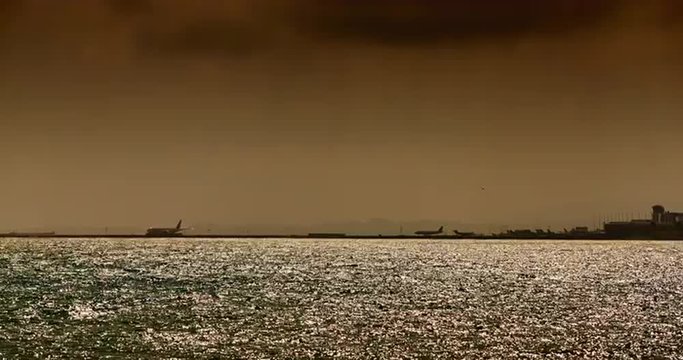 France, Nice, 12.09.2015: Nice airport at sunset, Aircraft take off and land with parking lights