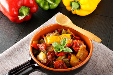 Peperonata: peppers cut into slices and baked in a pan