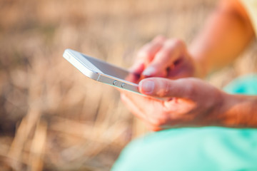  woman photographing herself with phone.