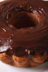 chocolate cake fancy bread on a plate macro. Vertical
