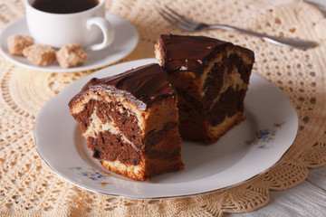 Chocolate piece of marble cake on a plate closeup horizontal
