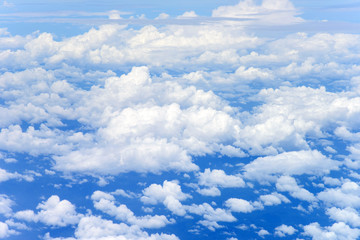 Clouds and sky from airplane window 