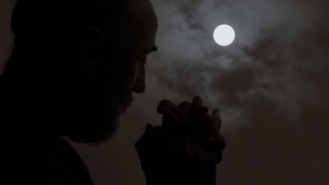 Silhouette moon religion pray intense light