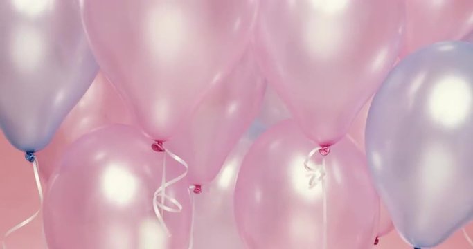 Confetti falling  in slow motion Pink and Blue balloons background - Red Epic Dragon