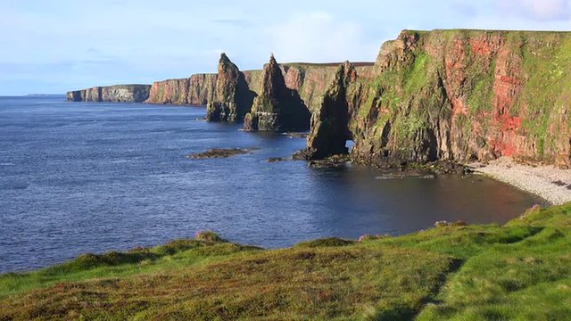 Establishing shot of the beautiful Duncansby Head sea stacks in Northern Scotland.