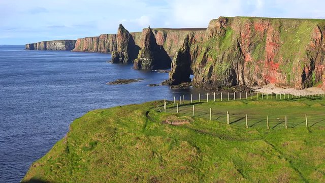 Establishing shot of the beautiful Duncansby Head sea stacks in Northern Scotland.