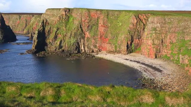 Panning shot of the beautiful Duncansby Head sea stacks in Northern Scotland.