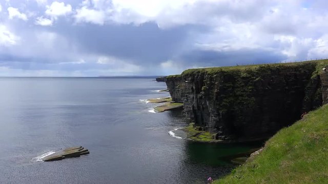 Establishing shot of the beautiful green coast of Scotland or Ireland.