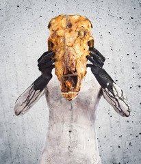 prehistoric man with veal skull