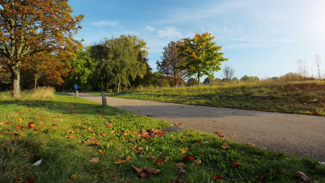 Runner man running outdoors in park