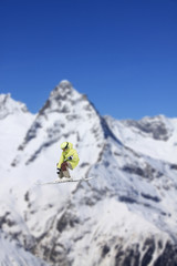 Naklejka na ściany i meble Flying skier on mountains
