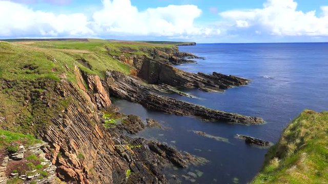 Establishing time lapse shot of the beautiful rugged ocean coast of Scotland or Ireland.