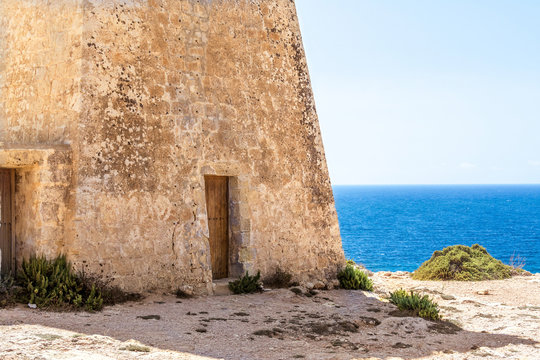 Tower on the Golden Bay beach in Malta