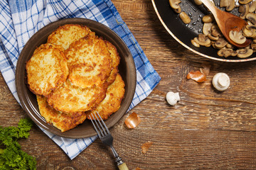 Homemade potato pancakes served with mushroom sauce and mushroom