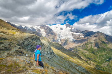 Adventure woman by glacier nature on Italy Alps