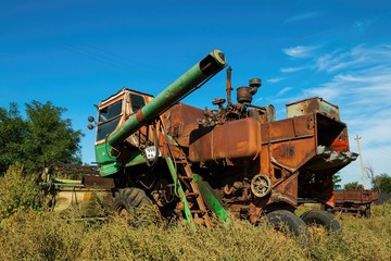 Old rusty Russian harvester combine, established near Rostov - on - Don.