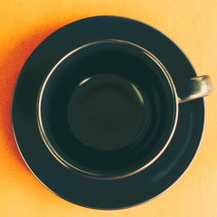 Empty cup of coffee on brown table use for put your text, Top view.