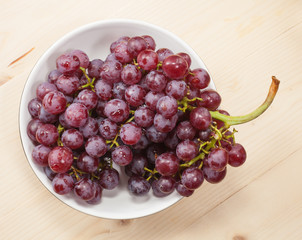 fresh grapes on wood table