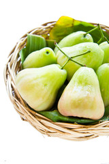 green rose apple on the basket