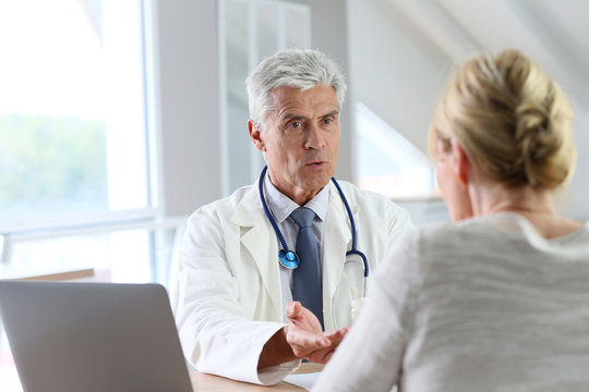Doctor having consultation with patient in office