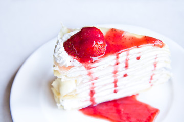 Crape cake with strawberry sauce