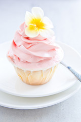 Cup cake with flower butter cream icing